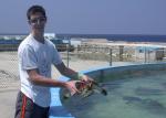 Bryan with a turtle.  He was scared to pick one up.