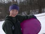 Good picture of Mona and her purple sled.