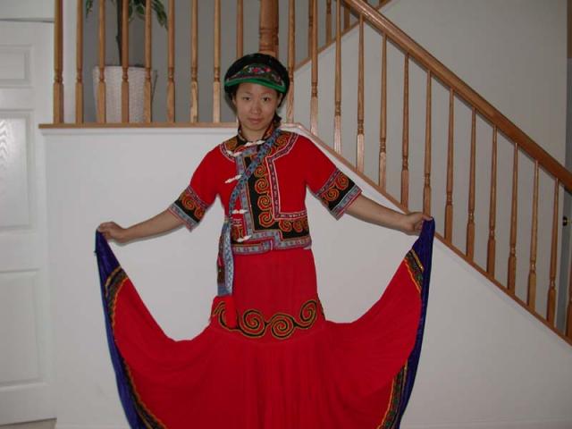 Mona in a cool ethnic dress, with a superlong bottom.