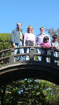 Dad, me, and Mom on a big barrel bridge in the Japanese Tea Garden.