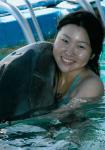 Helen hugging her dolphin friend, Abaco!