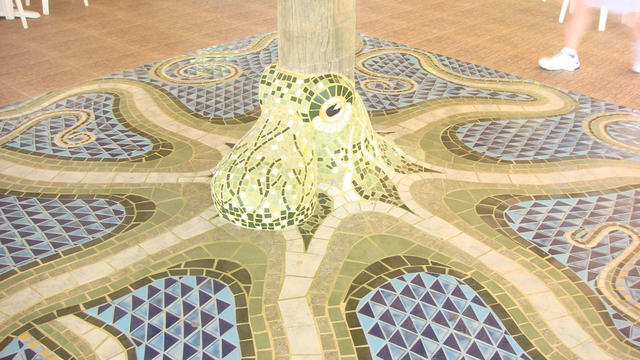 A crazy octopus mosaic on the floor.