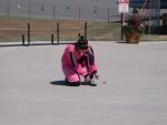 Susan tying her shoe in a pink jumpsuit!!!